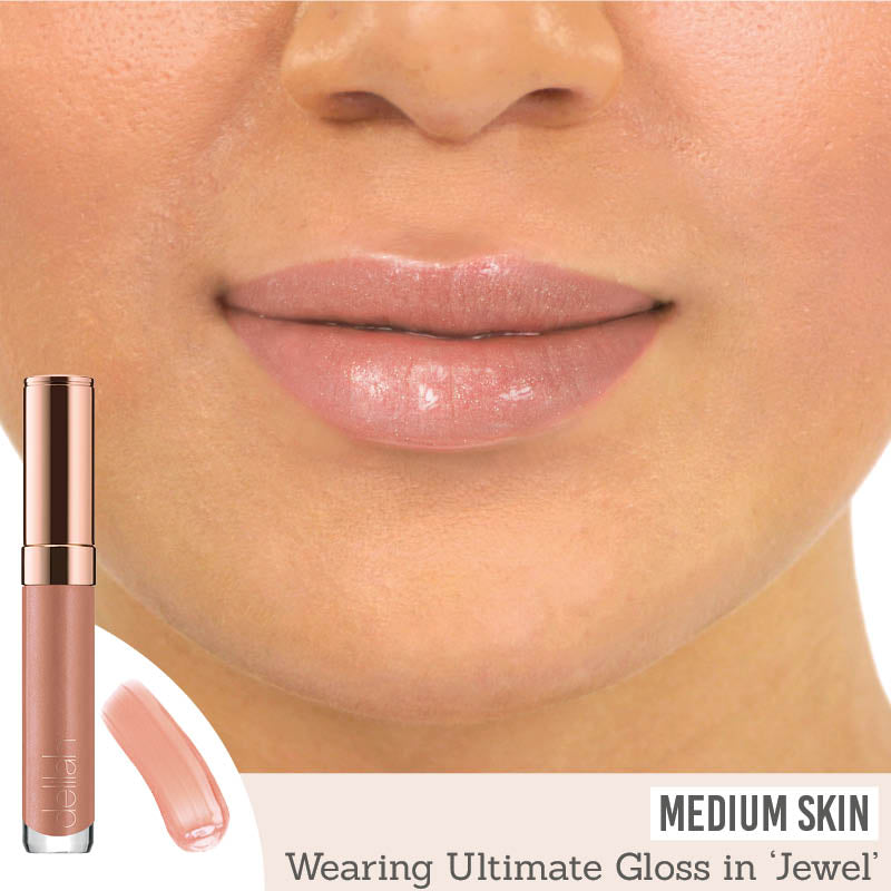 Delilah Ultimate Shine Lip Gloss in shade ‘Jewel’ results on medium skin