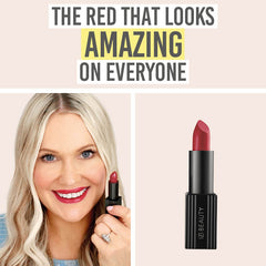 Katie holding IZI Beauty Empowered Lipstick in Thrive