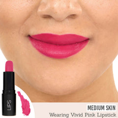 Rageism Beauty Matte Lipstick in Vivid Pink on medium skin
