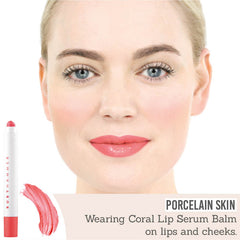 Ruby Hammer Coral Lip Serum Balm on porcelain skin